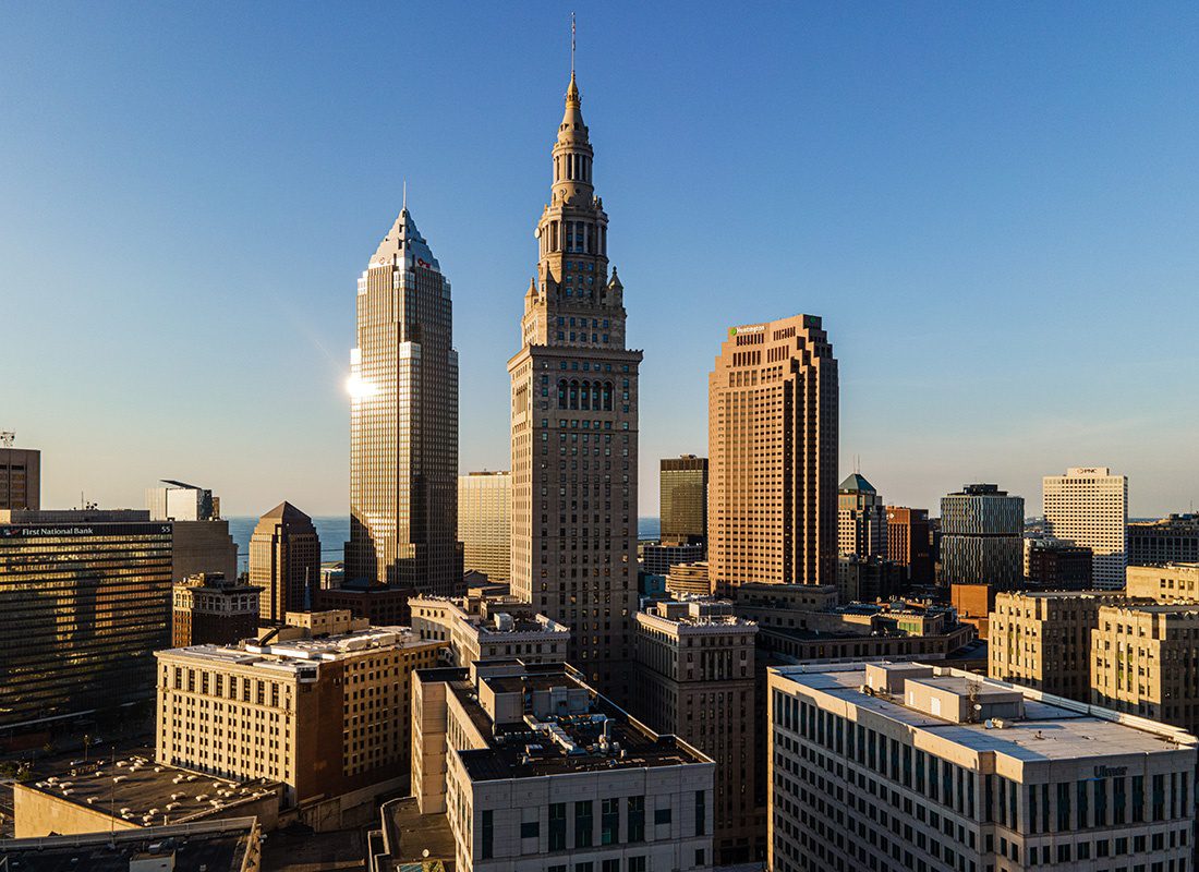 Business Insurance - View of Downtown Cleveland Ohio Skyscrapers Against a Clear Blue Sky at Sunset